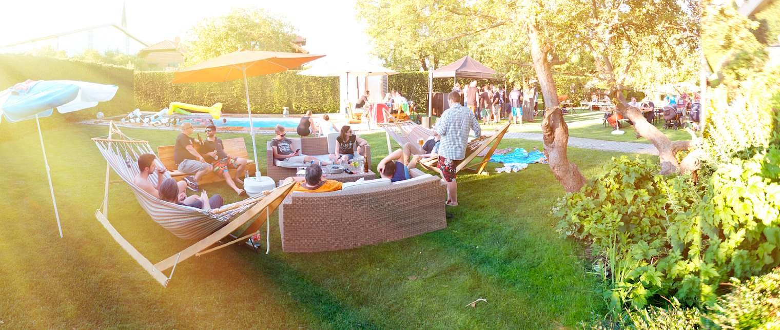 Summer party in the office garden — hammocks, pool and BBQ